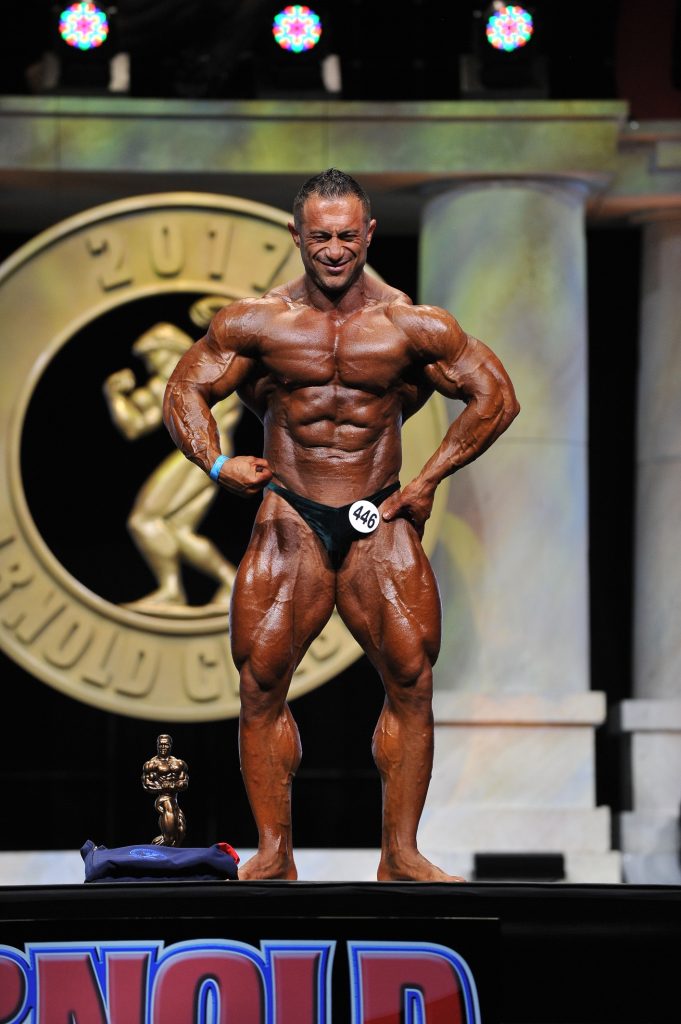 Winners Announced for the 11th Annual Arnold Amateur Bodybuilding, Fitness, Figure, Bikini and Physique Championships 8 Master Mens Bodybuilding Overall Winner Ahmed Fauzi of Switerland 446 photo by Jeff Binns