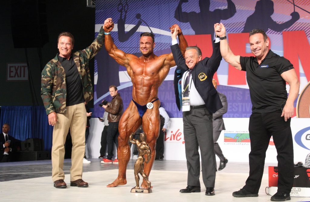 Winners Announced for the 11th Annual Arnold Amateur Bodybuilding, Fitness, Figure, Bikini and Physique Championships 7 Men’s Bodybuilding Overall Winner Paul Poloczek of Germany Left to Right Gov. Arnold Schwarzenegger Poloczek Dr. Rafael Santonja Rich Gaspari